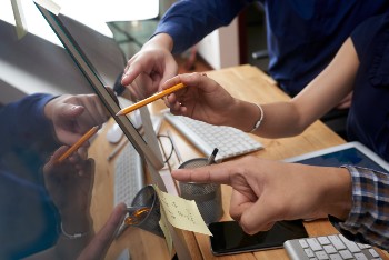 business-people-pointing-at-screen-2023-11-27-05-08-48-utc