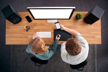 overhead-view-of-male-and-female-graphic-designers-2024-10-21-09-48-36-utc