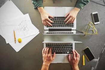 top-view-of-architects-working-at-computer-in-offi-2023-11-27-05-21-18-utc