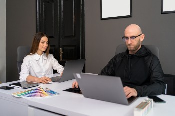 two-colleagues-discussing-new-information-about-pr-2024-10-14-10-47-30-utc
